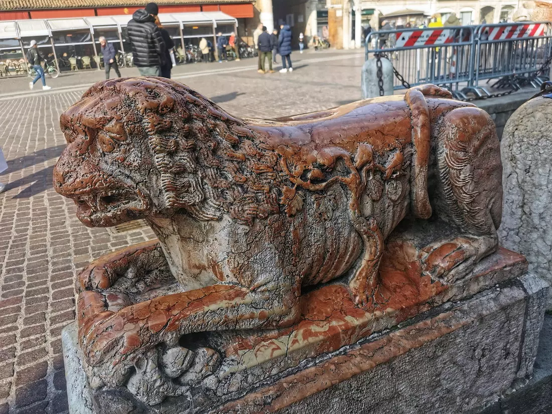 Stone lion sculptures at the entrance of Ferrara Cathedral