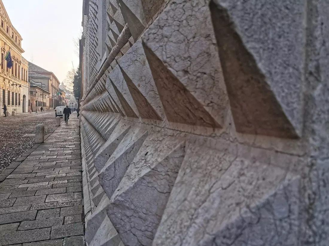Close-up of the diamond-shaped marble blocks on Palazzo dei Diamanti façade