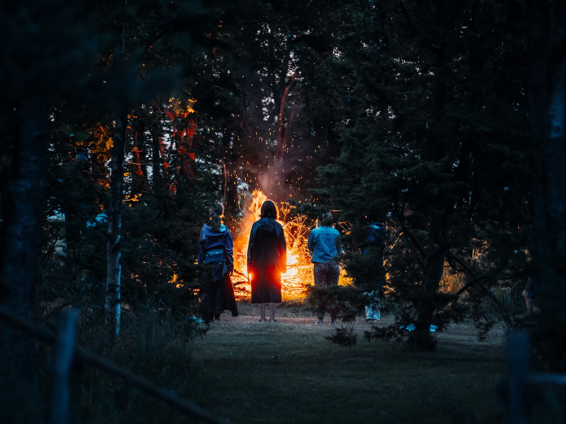 People gathered around a traditional Jaanituli bonfire on Prangli Island during Midsummer in Estonia
