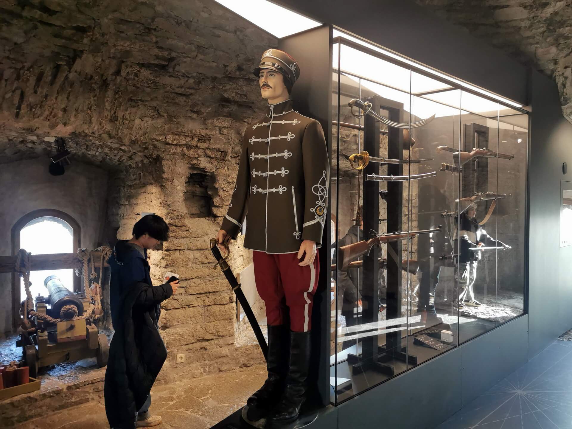 Exhibition inside the Kiek in de Kök tower featuring military mannequins and glass display cases