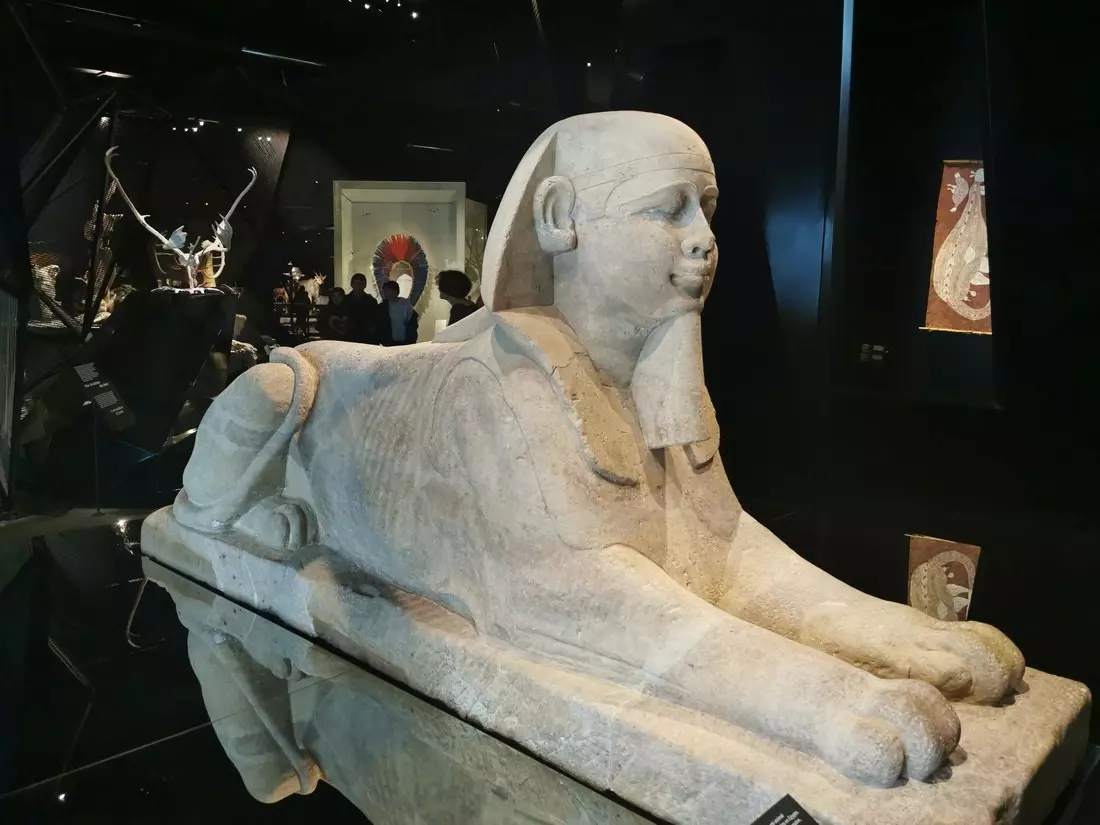 Egyptian collection: Ancient Egyptian artefacts including figurines and funerary items at Lyon’s Musée des Confluences.