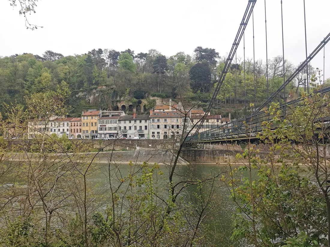 Bridge to Île Barbe over the Saône River in Lyon, connecting the historic island to the mainland.