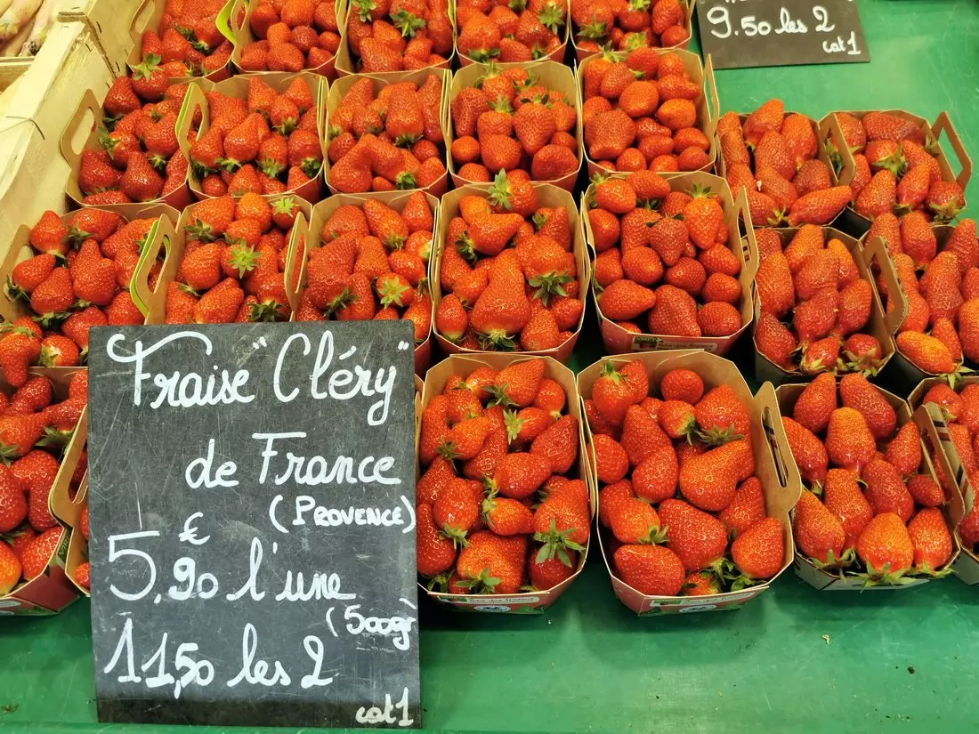 Fresh seasonal strawberries for sale at Marché de la Croix-Rousse in Lyon