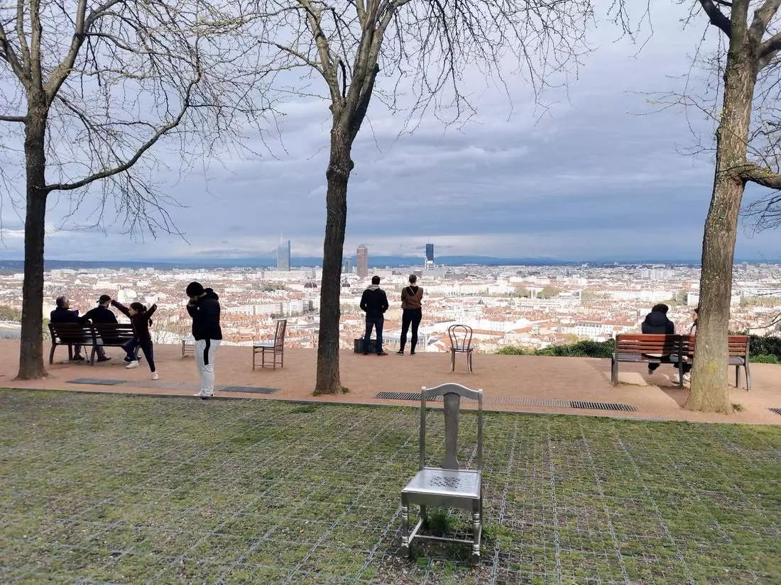 View from Jardin des Curiosités with metal chairs overlooking Lyon.