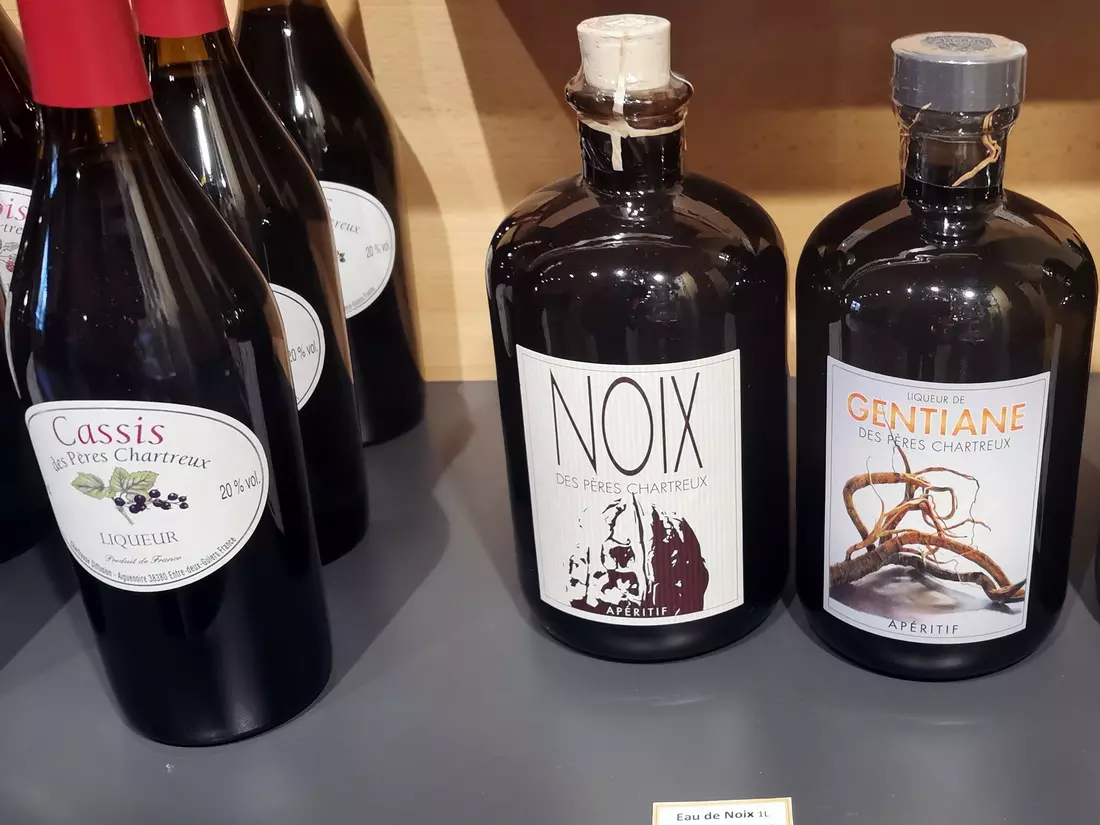 Bottles of Chartreuse liqueur on display, produced by the Carthusian monks near Lyon.