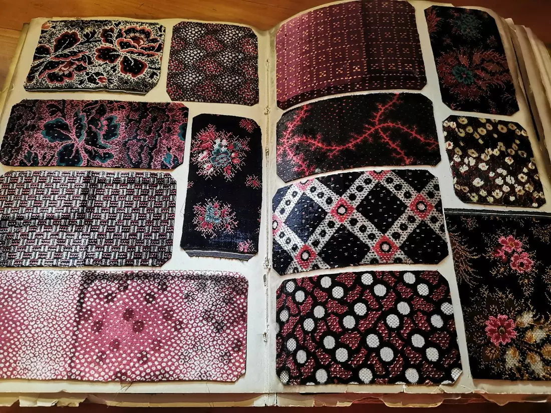 Display of silk patterns and textiles at Maison des Canuts in Lyon.