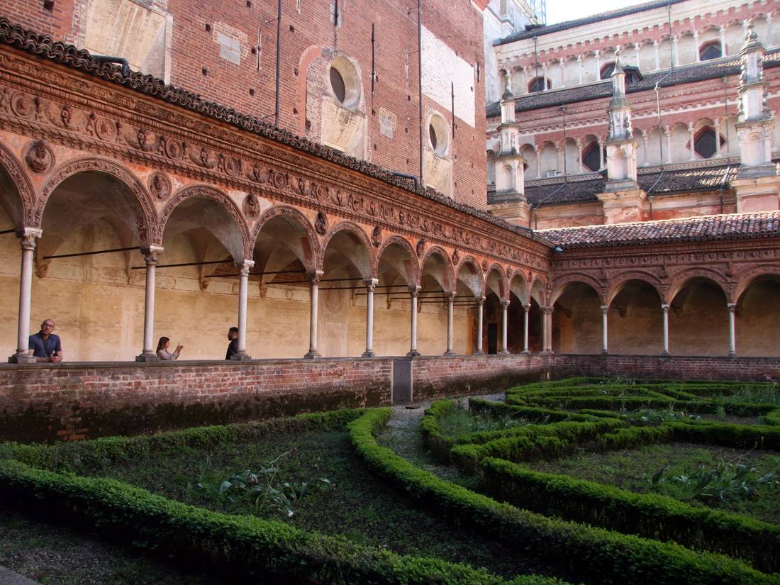 View of the main cloister garden and arched gallery at Certosa di Pavia
