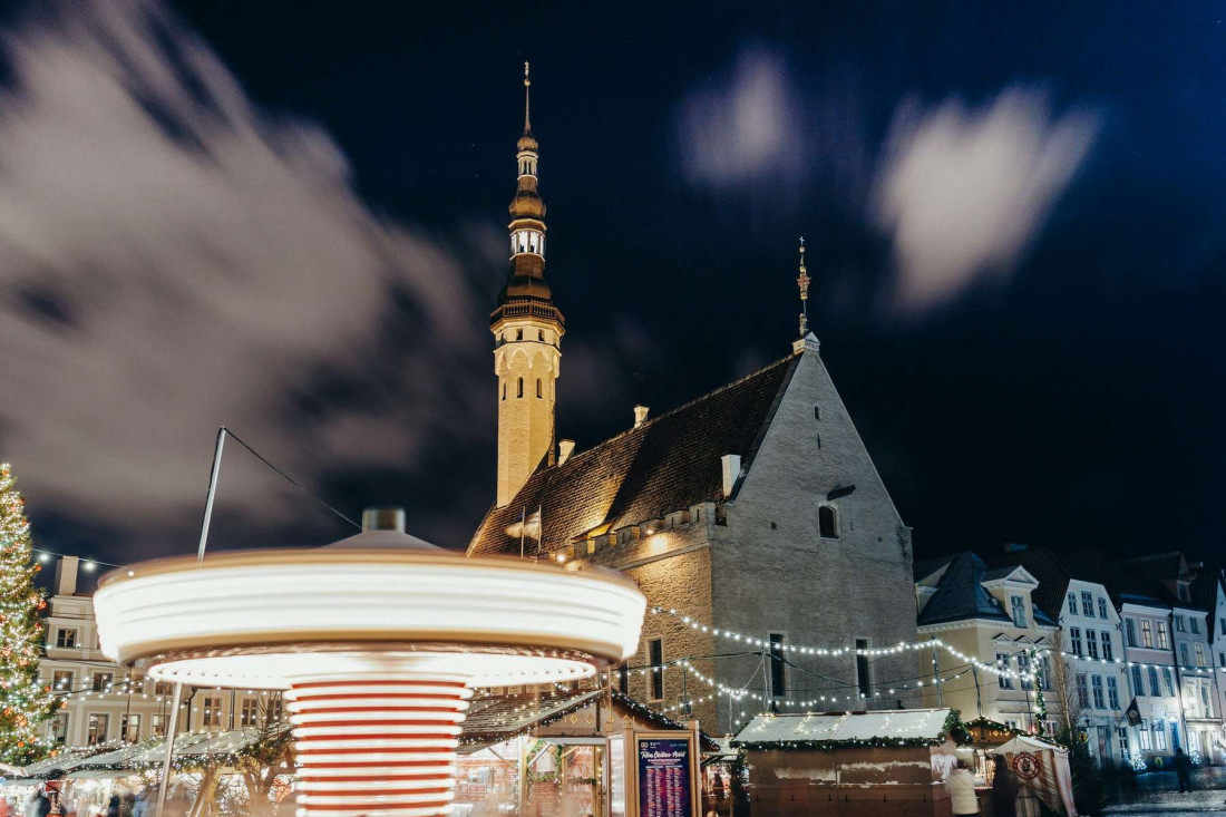 A vibrant evening view of Tallinn's Town Hall Square during the festive season