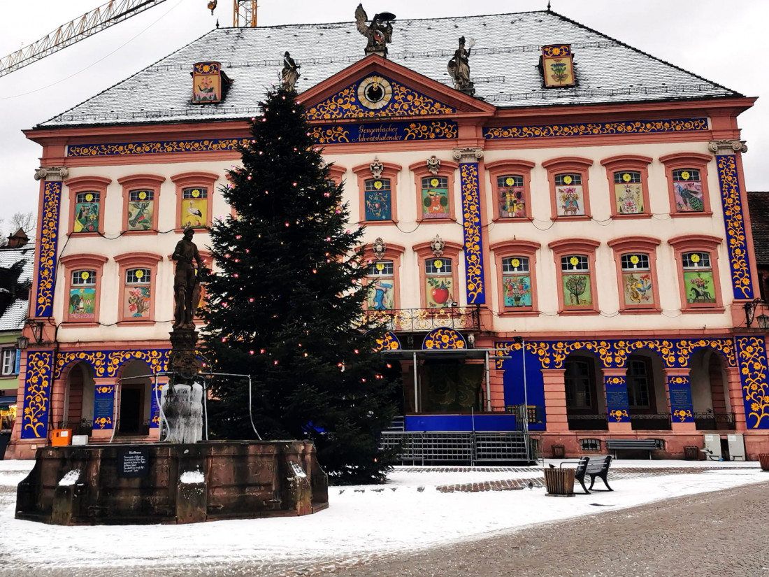 The Rathaus in Gengenbach in winter, decorated as the world’s largest Advent calendar, with a Christmas tree on the market square.