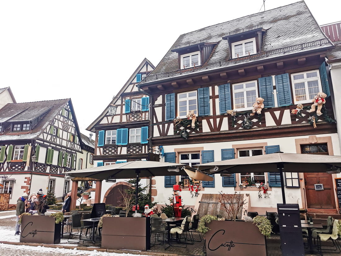 Colorful half-timbered houses with blue shutters and winter decorations in Gengenbach.