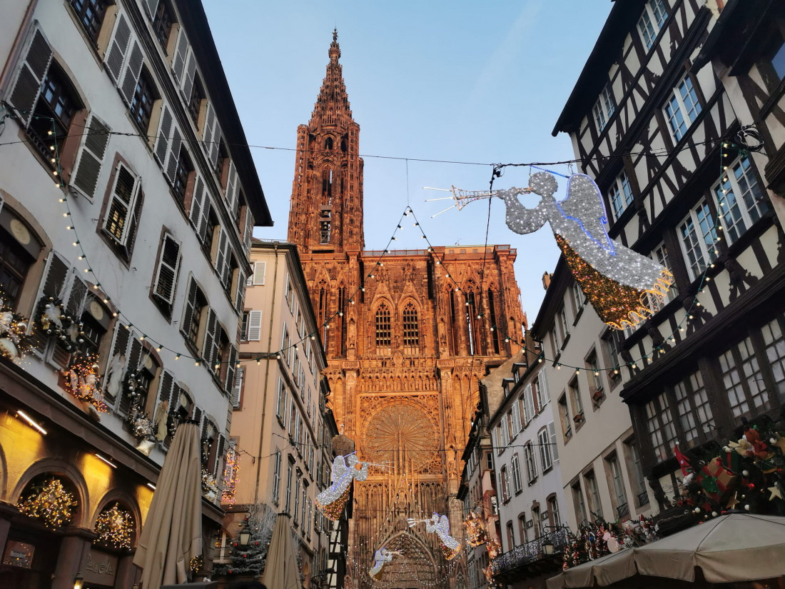 Strasbourg Cathedral view from Rue Mercière with illuminated Christmas angel decorations in winter