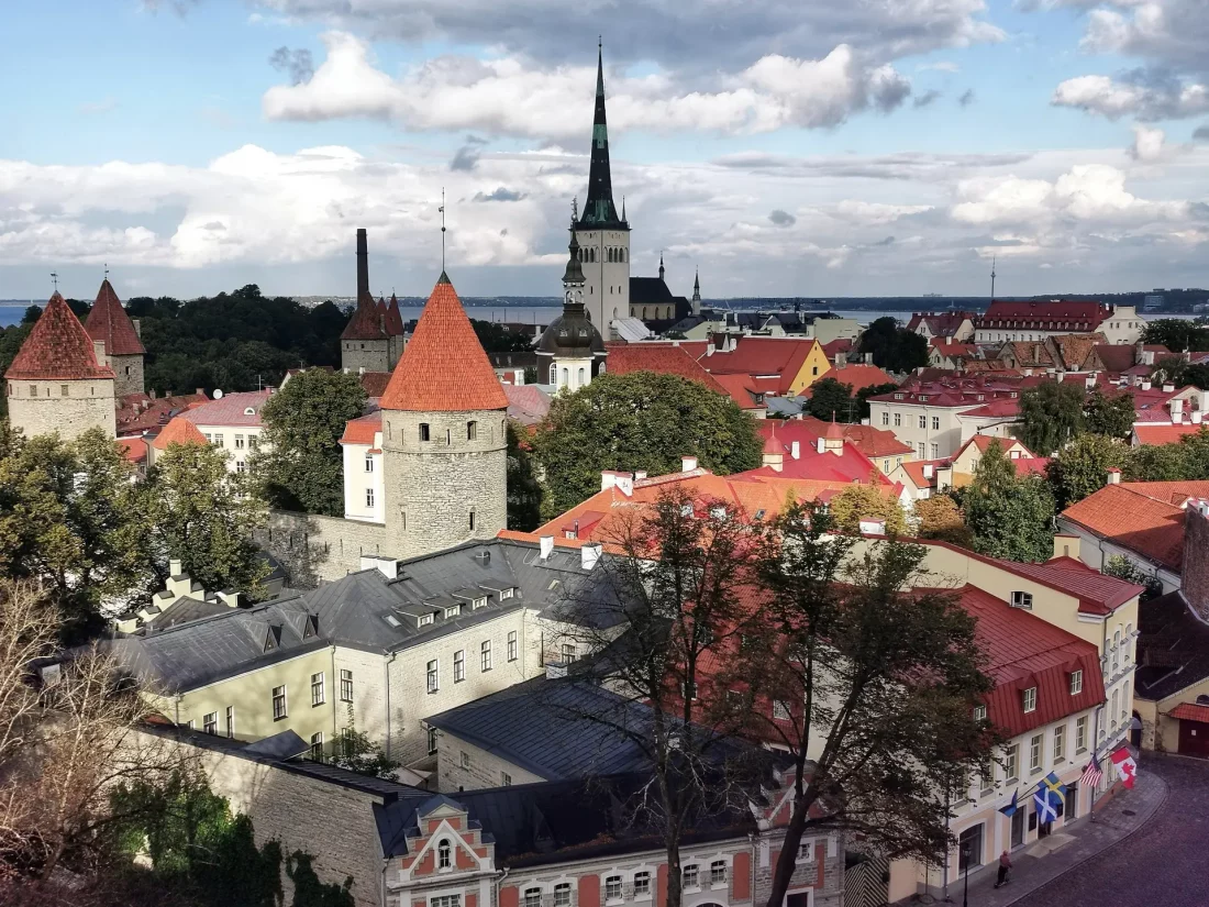 View over Tallinn Old Town with red rooftops and St. Olaf’s Church tower — classic skyline for a 2-day Tallinn itinerary
