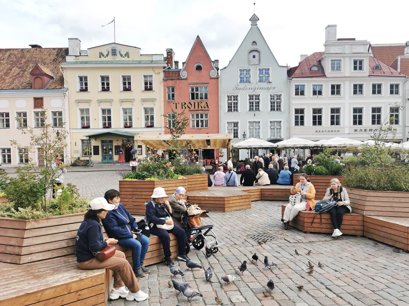 Tallinn Old Town Town Hall Square with pastel medieval houses and outdoor cafés