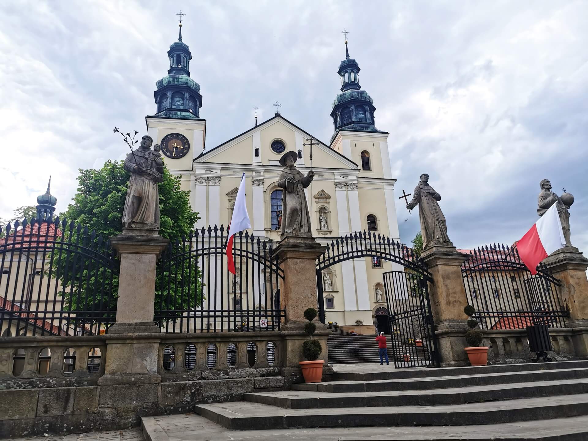 Kalwaria Zebrzydowska monastery appearing above the hillside after the uphill walk through town