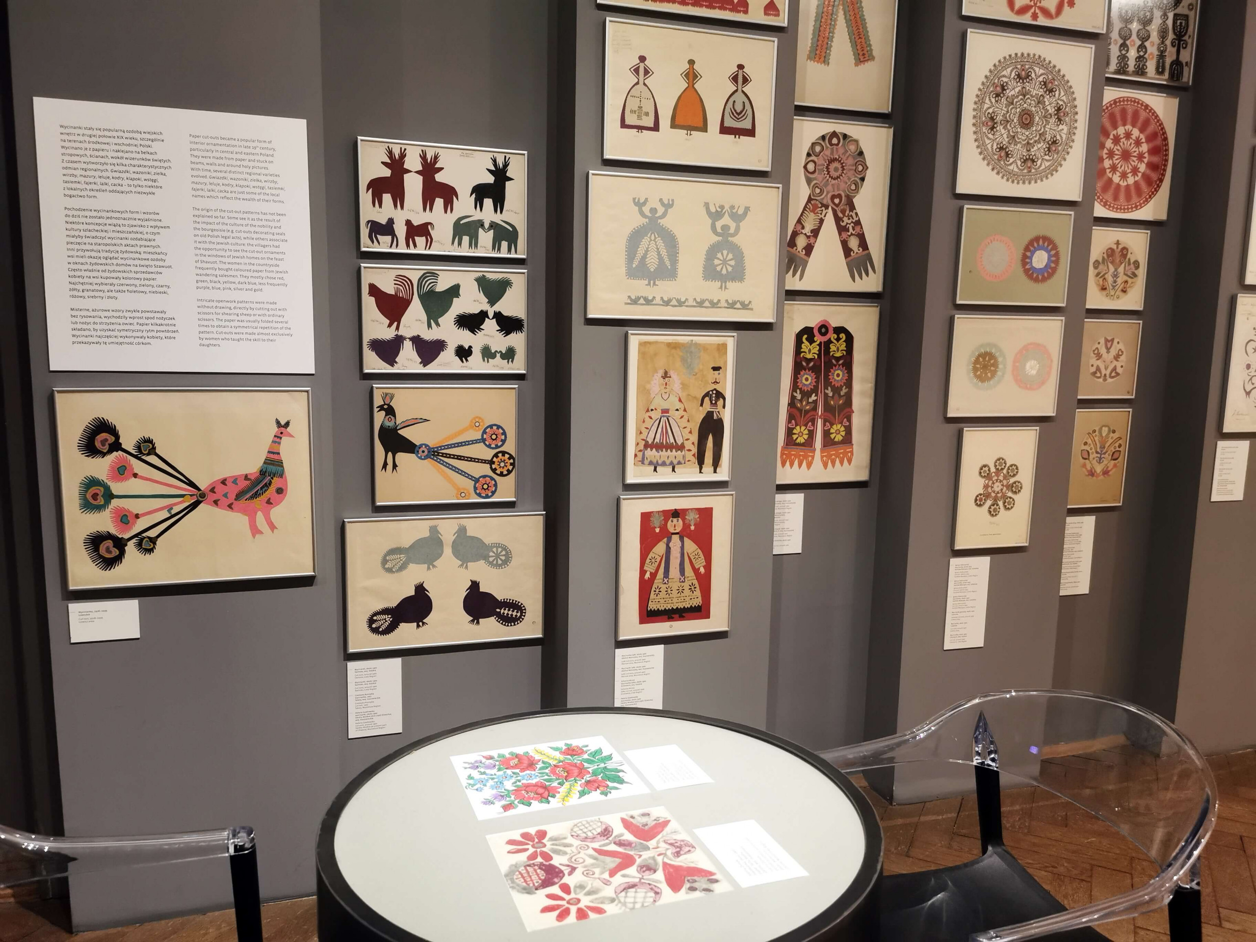 gallery wall filled with colourful traditional paper cut designs