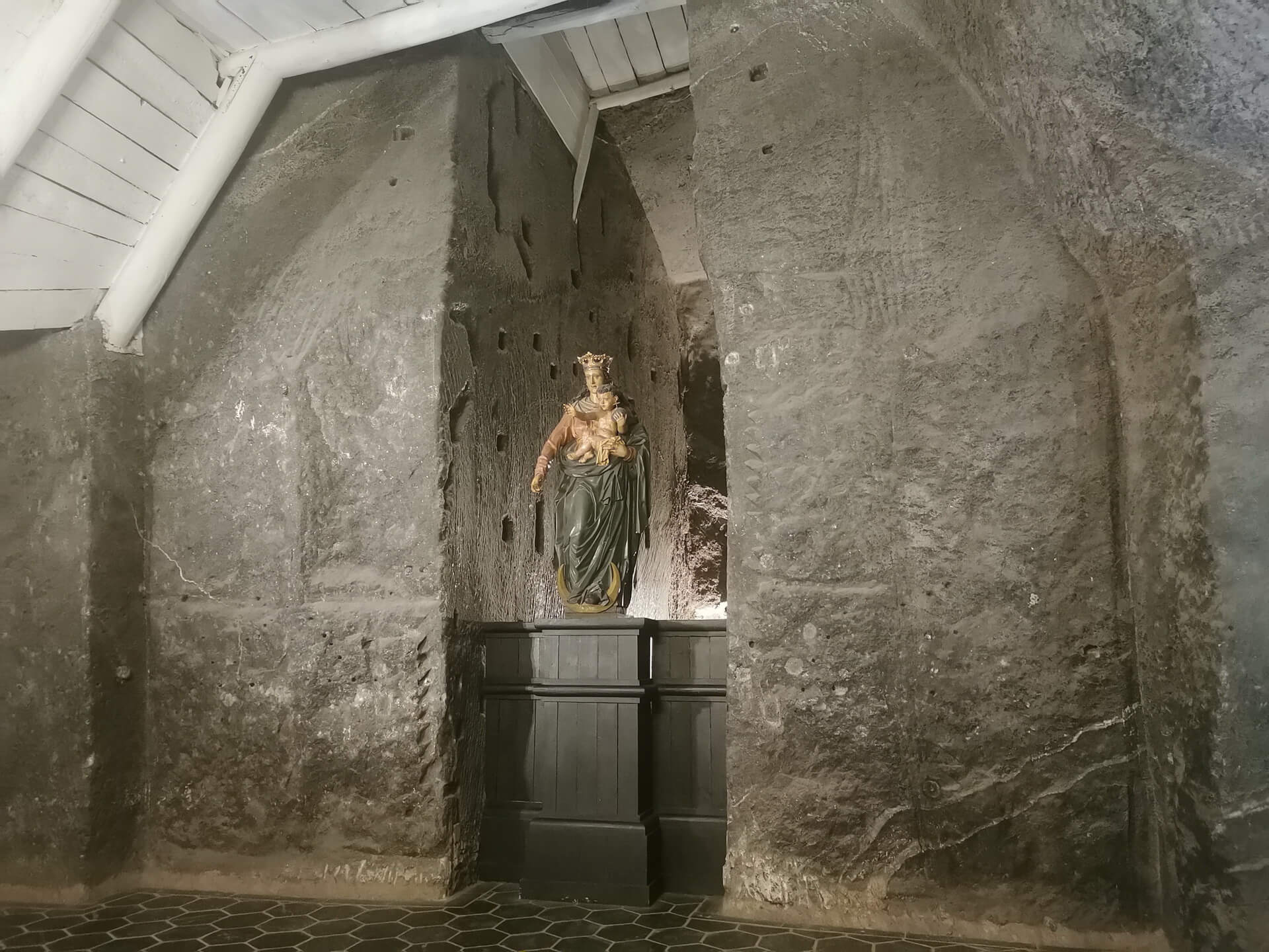 Religious statue surrounded by grey salt walls